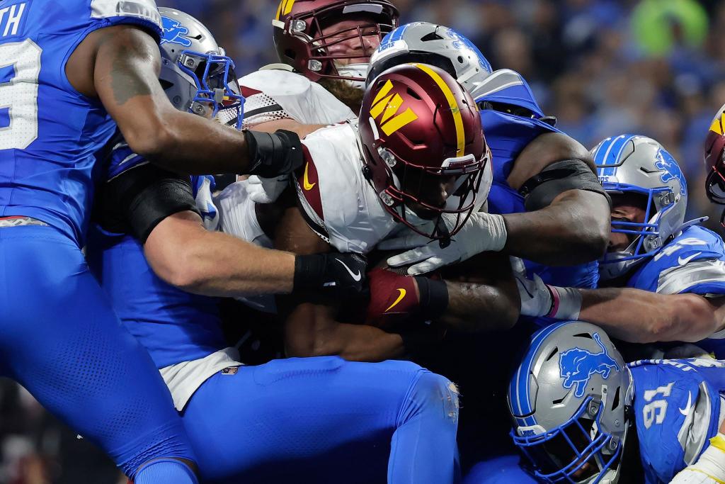 Brian Robinson und die Washington Commanders fanden fast immer einen Weg durch die Abwehr der Lions. - Foto: Rey Del Rio/AP/dpa