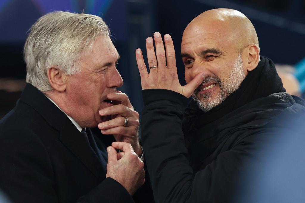 Nur einer wird nach dem nächsten Duell von Carlo Ancelotti (l) und Pep Guardiola noch lachen. - Foto: Darren Staples/AP/dpa